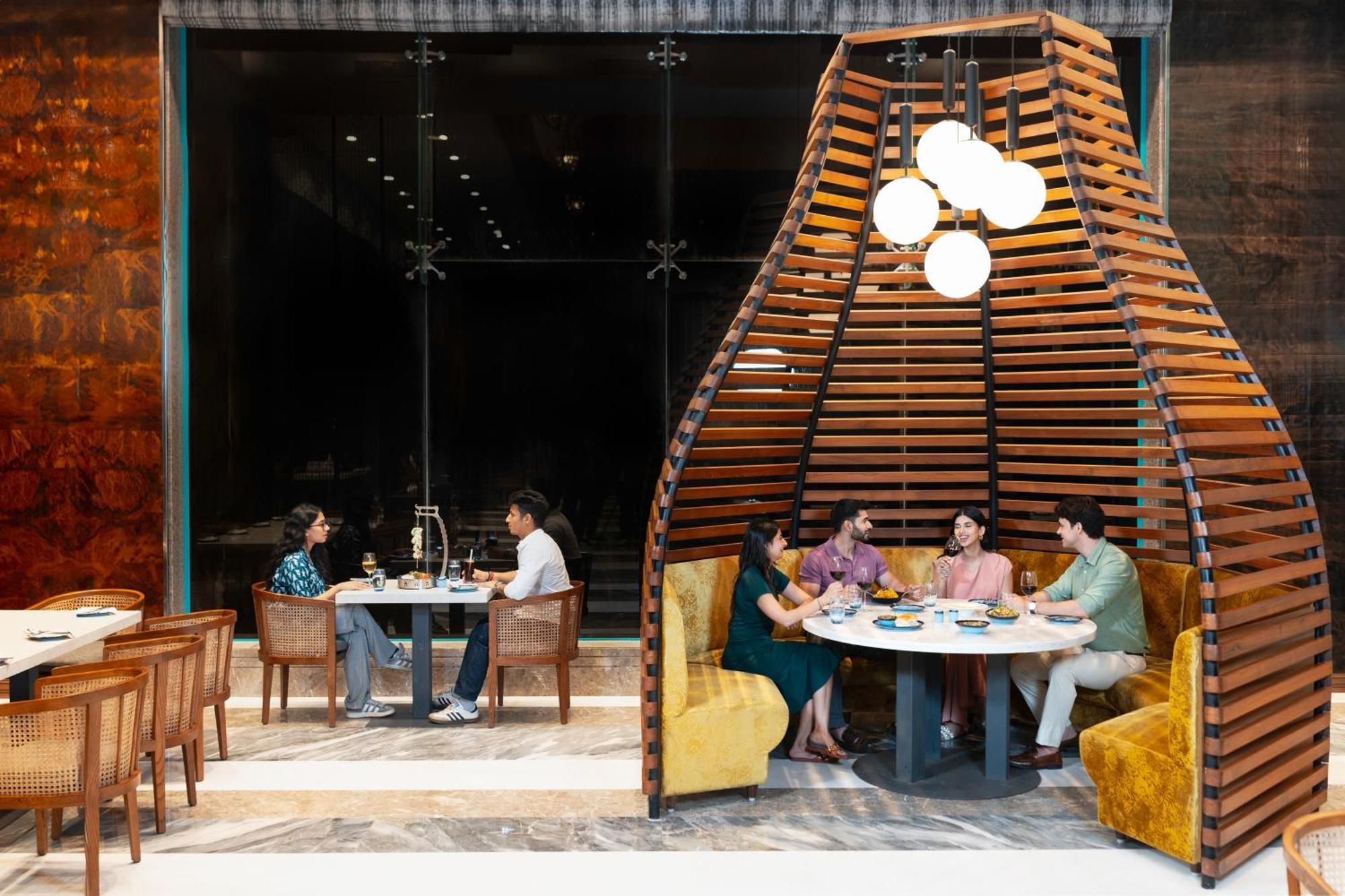 Radisson Blu Plaza Resort & Convention Centre Карджат Екстериор снимка The interior of the restaurant